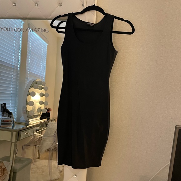 MAJOR CLOSET SALE. MORE ITEMS TO COME. 100% Lycra black mini dress. Very tight. - Picture 1 of 2